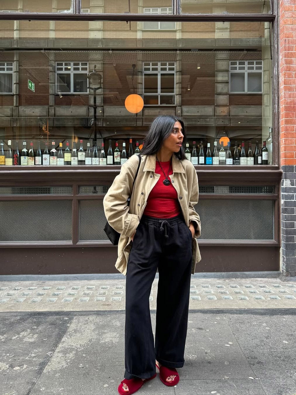 Beige Barn Jacket With Red Top And Black Wide Leg Pants — Trendy Barn Jacket Outfit
