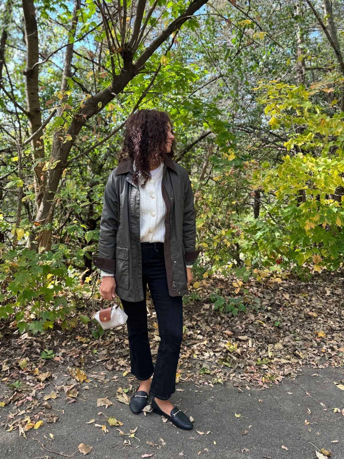 Dark Green Barn Jacket With Knit Cardigan And Black Jeans — Trendy Barn Jacket Outfit