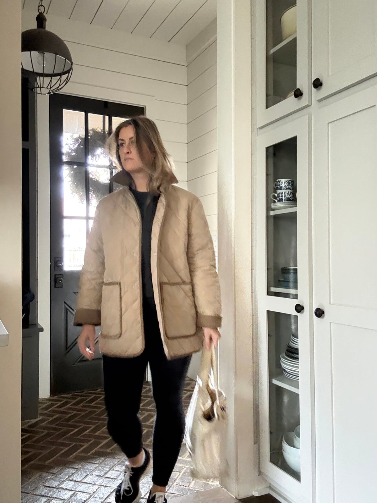 Beige Quilted Barn Jacket With Dark Top And Leggings — Trendy Barn Jacket Outfit