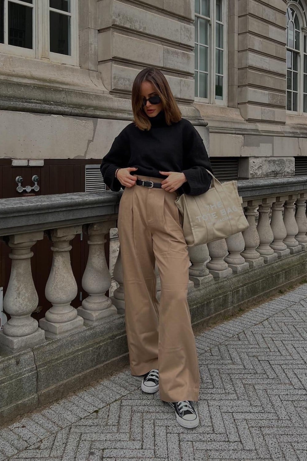 Black Turtleneck and Beige Wide-Leg Trousers, Close-Up Take — Trendy Basic Outfits