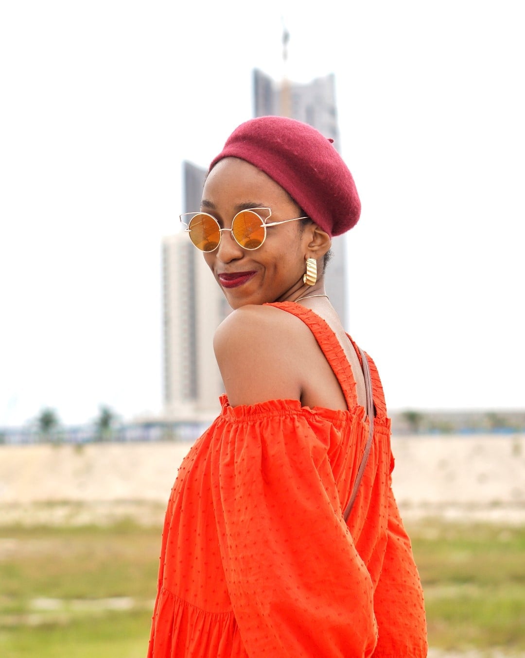 Red Beret with a Textured Orange Dress — Trendy Beret Outfits