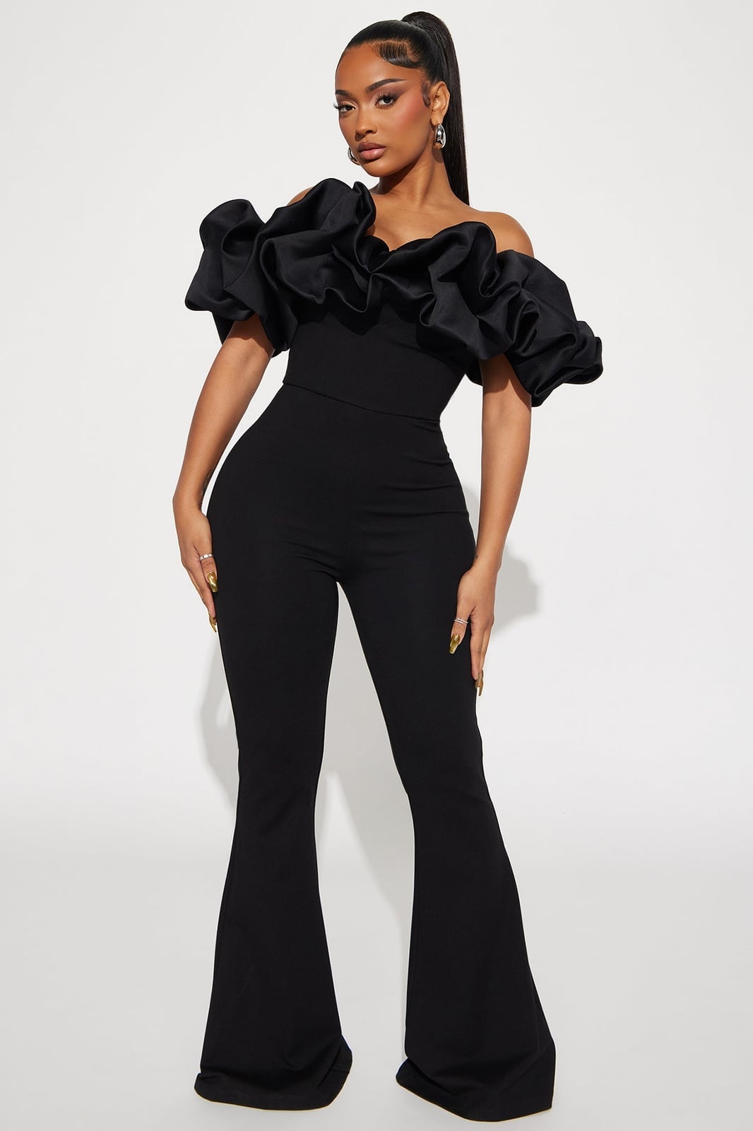 Black Off-Shoulder Jumpsuit with Flared Trousers for a Birthday Party — Trendy Birthday Outfits
