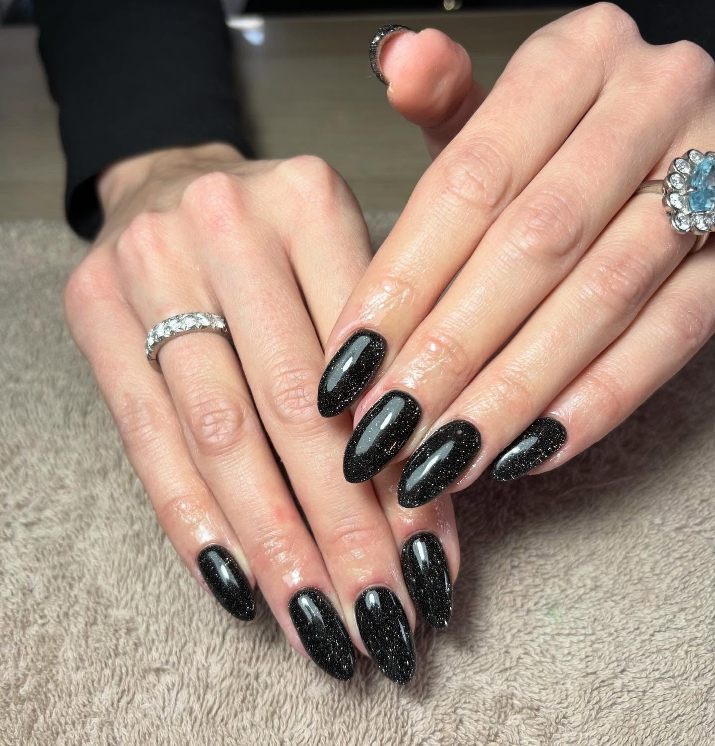 Shimmering Black Glitter Medium Almond Nails — Trendy Black Almond Nails