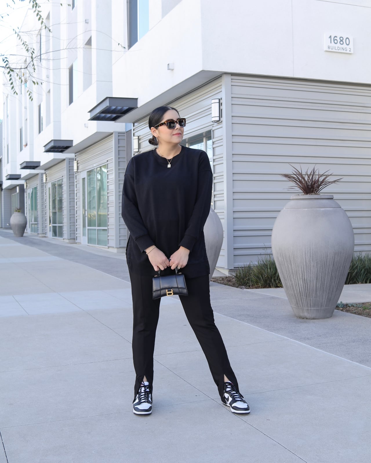 Oversized Black Sweatshirt with Split-Hem Trousers — Trendy Black and White Outfits