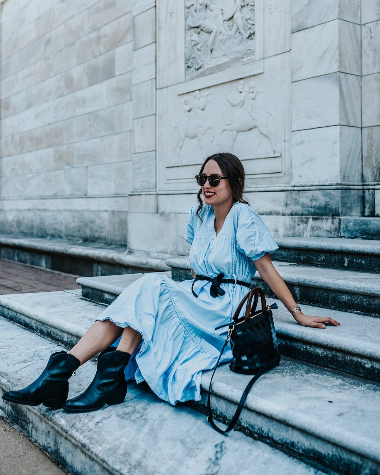 Black Cowboy Boots with a Tiered Light Blue Dress and Belt — Trendy Black Cowboy Boots Outfit