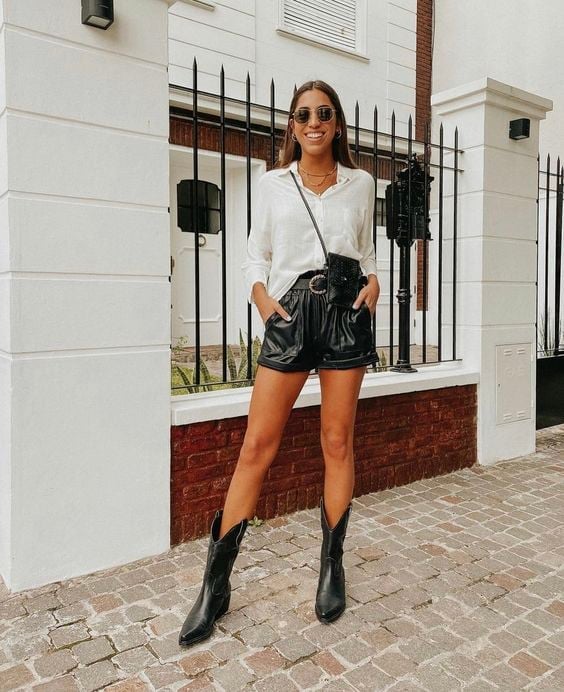 Black Leather Cowboy Boots with Leather Shorts and Button-Down Shirt — Trendy Black Cowboy Boots Outfit