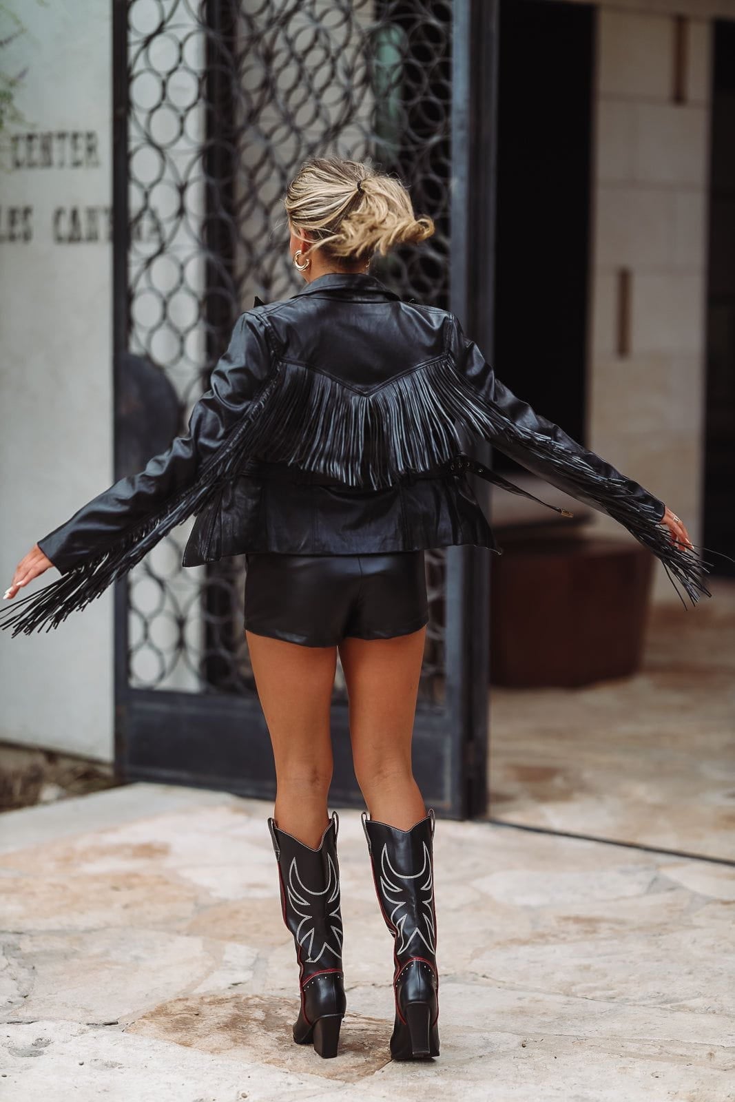 Black and Red Cowboy Boots with Fringe Leather Jacket — Trendy Black Cowboy Boots Outfit