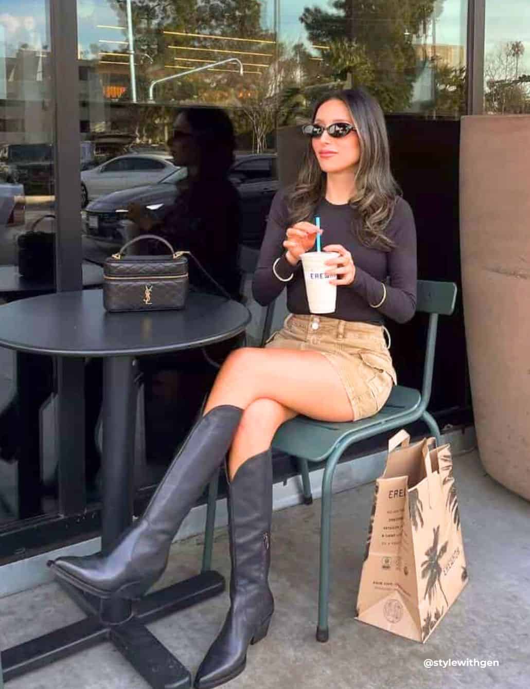 Black Knee-High Cowboy Boots with Beige Mini Skirt and Long-Sleeve Top — Trendy Black Cowboy Boots Outfit