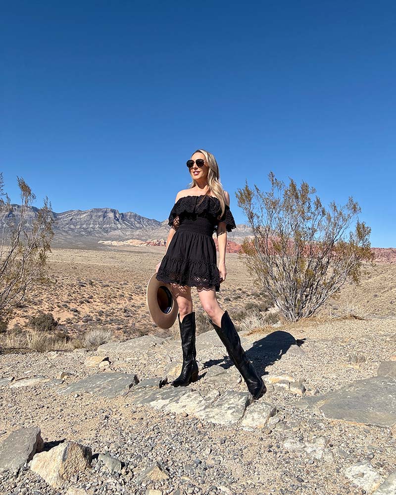 Black Cowboy Boots with an Off-The-Shoulder Mini Dress — Trendy Black Cowboy Boots Outfit