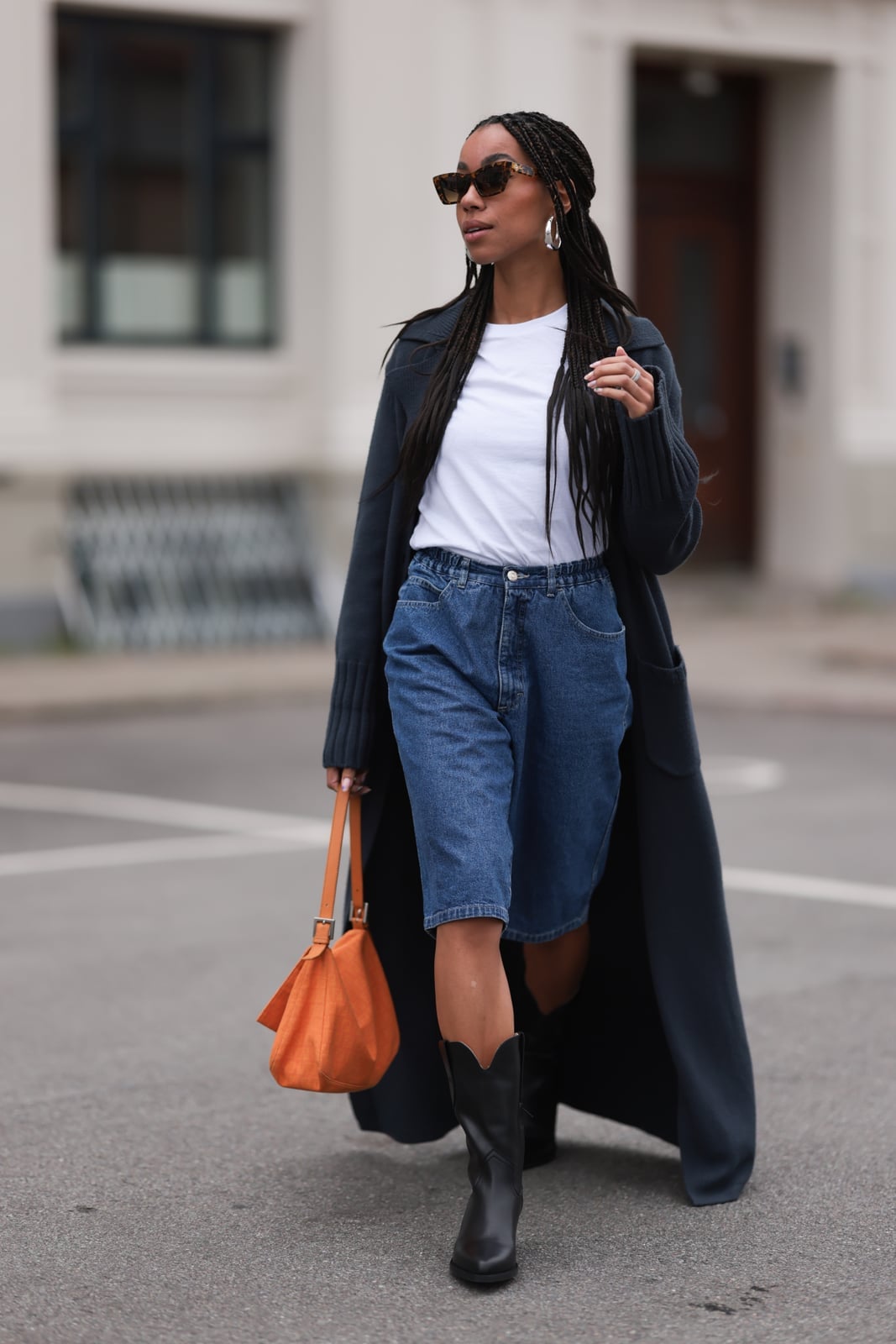 Black Leather Cowboy Boots with Midi Denim Skirt and Cardigan — Trendy Black Cowboy Boots Outfit