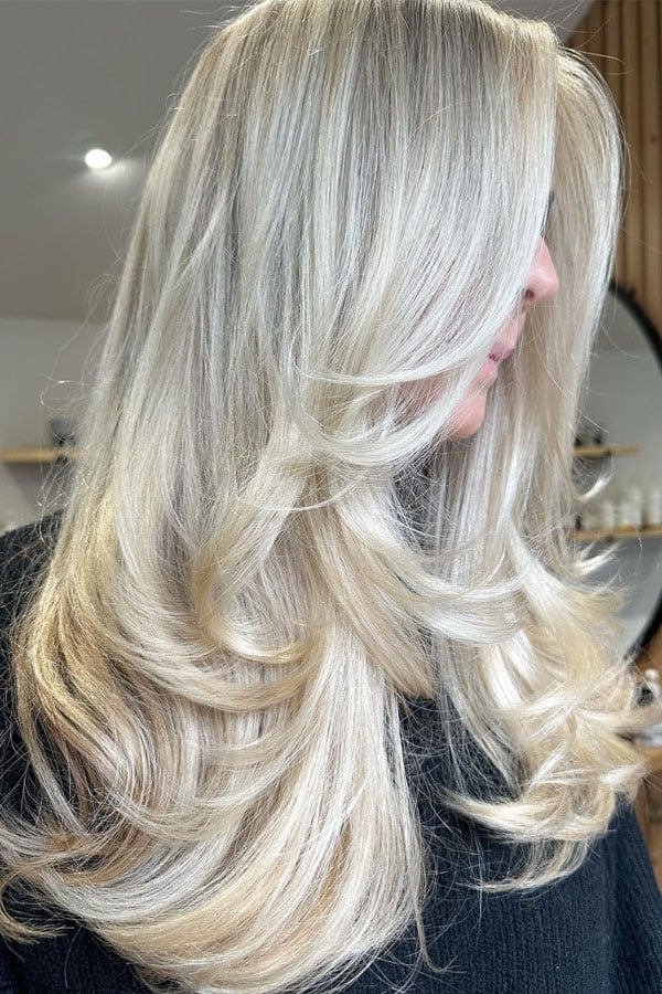 Mid-Back Ash Blonde Balayage With Curtain Bangs Mid-Back Ash Blonde Balayage With Curtain Bangs — Trendy Blonde Balayage