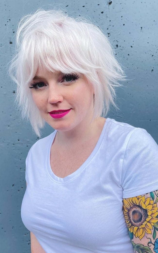 Icy Platinum Choppy Shag With Blunt Fringe Icy Platinum Choppy Shag With Blunt Fringe — Trendy Blonde Short Hair