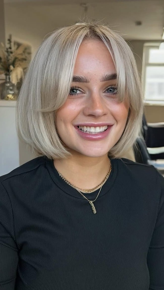 Icy Platinum Bob With Curtain Bangs Icy Platinum Bob With Curtain Bangs — Trendy Blonde Short Hair
