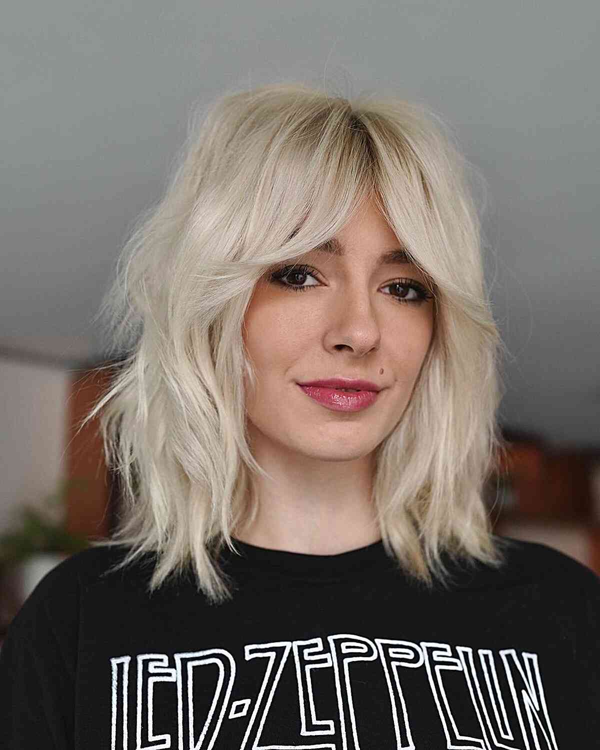 Platinum Shag With Curtain Bangs Platinum Shag With Curtain Bangs — Trendy Blonde Short Hair