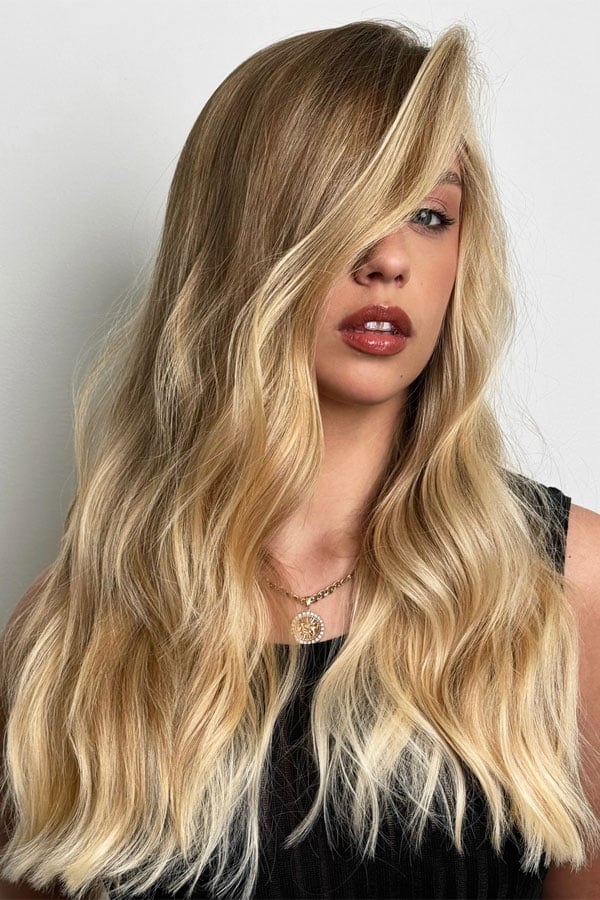 Mid-Back Golden Blonde With Sun-Kissed Highlights Mid-Back Golden Blonde With Sun-Kissed Highlights — Trendy Blonde Wavy Hair
