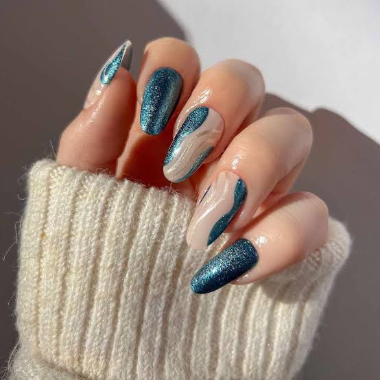 Medium Almond Shimmering Teal Swirl Nails Medium Almond Shimmering Teal Swirl Nails — Trendy Blue Acrylic Nails
