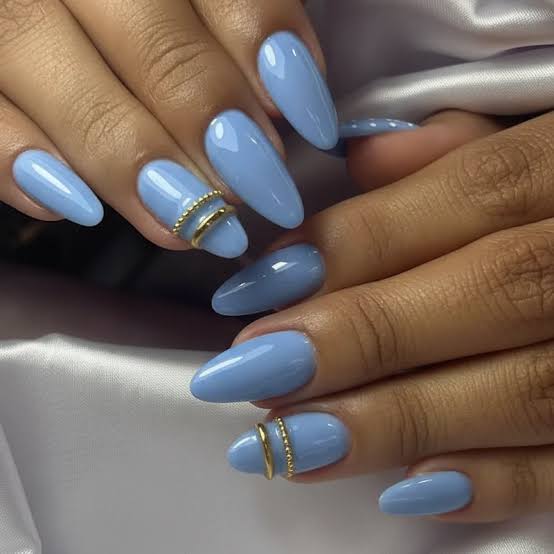 Medium Oval Light Blue Nails With Gold Rings Medium Oval Light Blue Nails With Gold Rings — Trendy Blue Acrylic Nails
