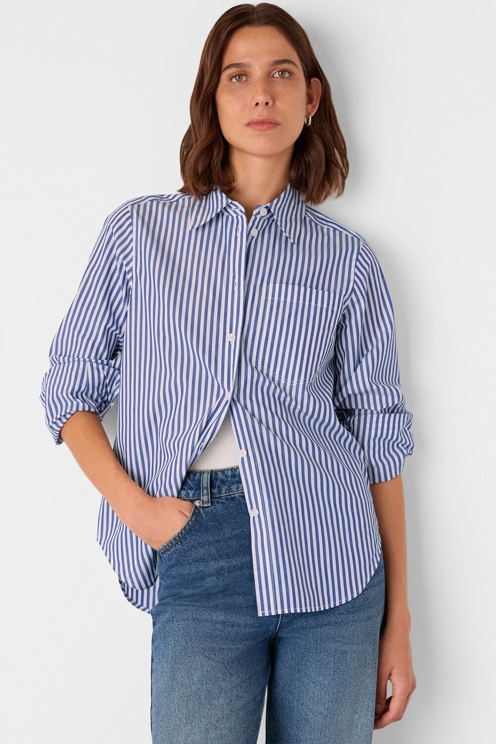 Blue and White Striped Shirt Over White Tank with Blue Jeans — Trendy Blue and White Outfits