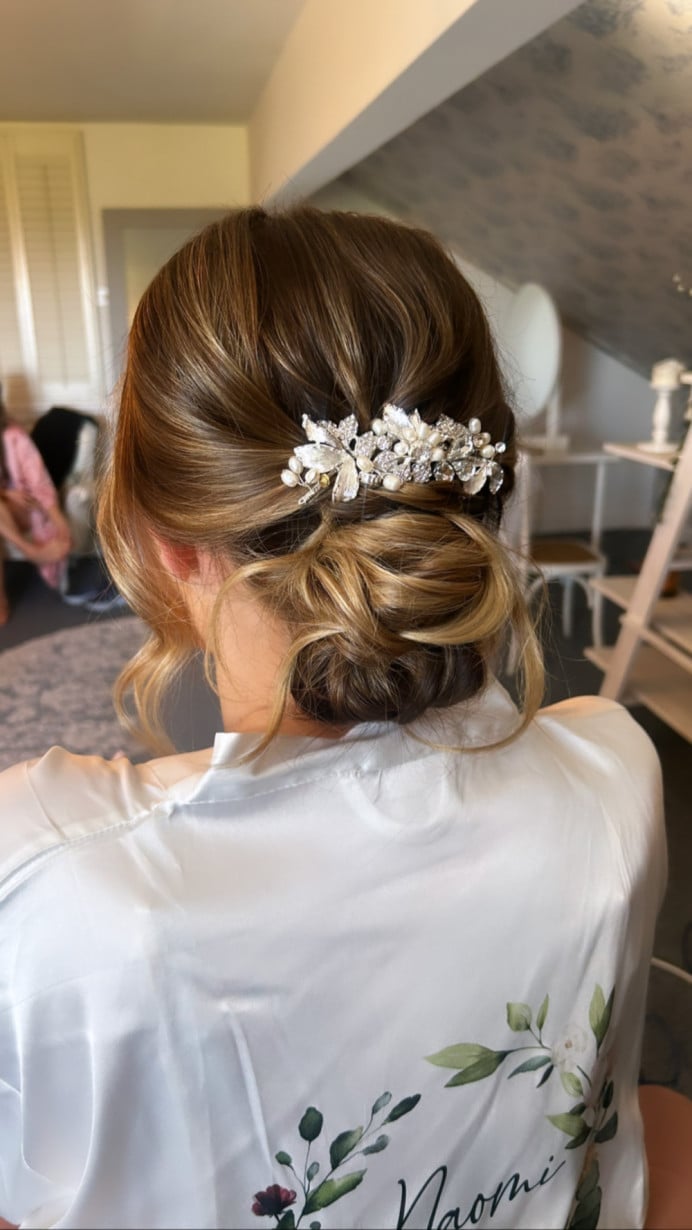 Low Bun With Soft Tendrils and Comb Low Bun With Soft Tendrils and Comb — Trendy Bridal Hair
