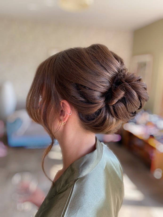 Sculpted Chignon With Face-Framing Pieces Sculpted Chignon With Face-Framing Pieces — Trendy Bridesmaid Hairstyles Updo