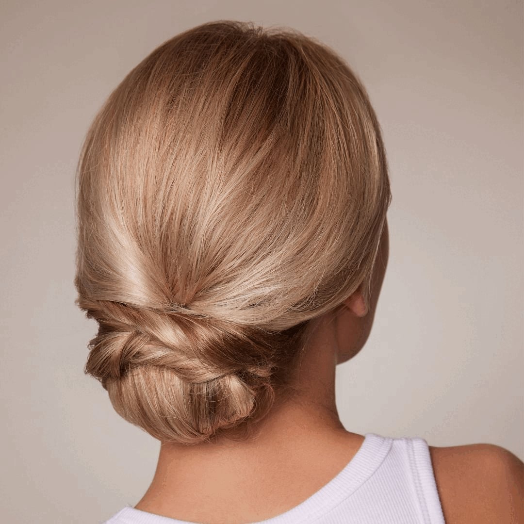 Twisted Low Bun With Clean Finish Twisted Low Bun With Clean Finish — Trendy Bridesmaid Hairstyles Updo