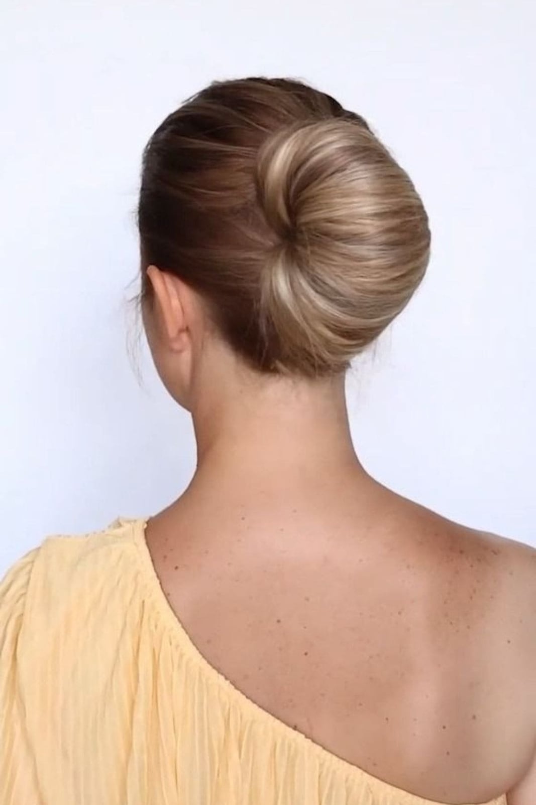 Classic Updo With Smooth Twisted Bun Classic Updo With Smooth Twisted Bun — Trendy Bridesmaid Hairstyles Updo