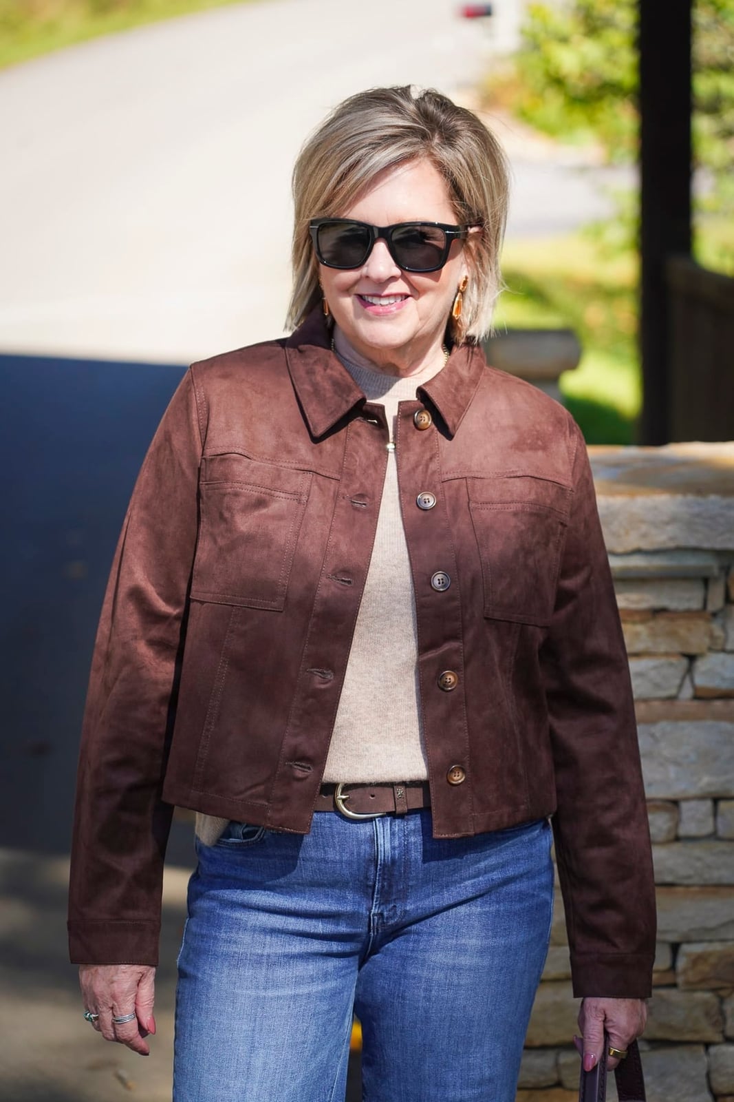 Cropped Suede Jacket With Blue Jeans — Trendy Brown Jacket Outfit