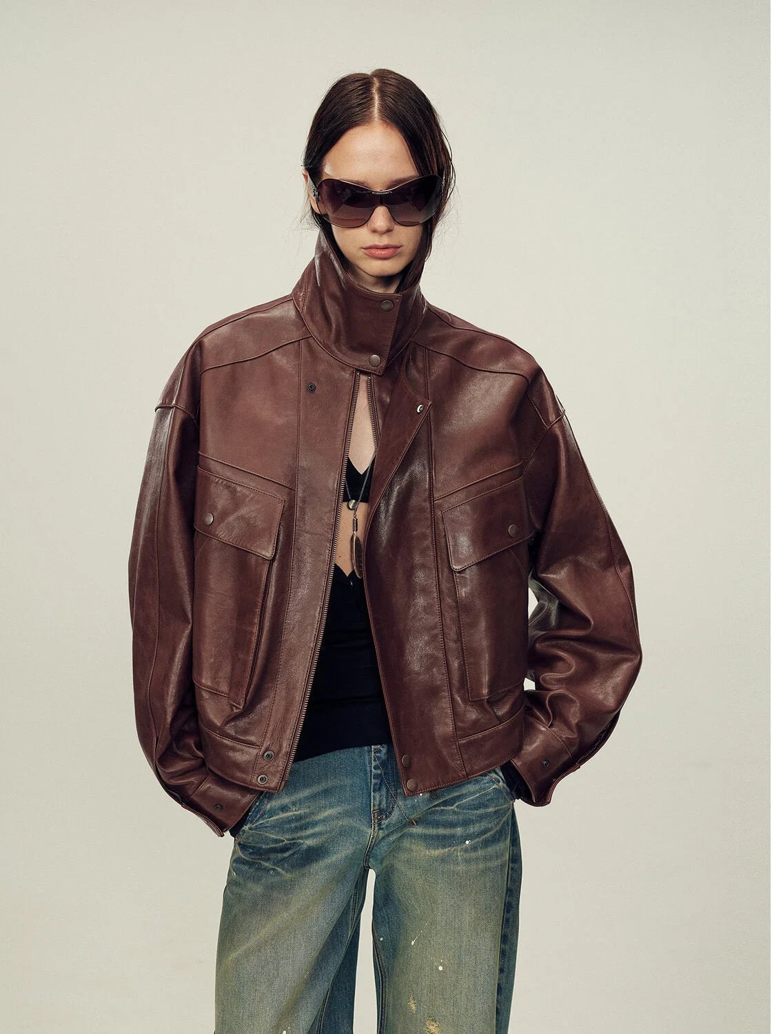 Relaxed Leather Jacket With Distressed Jeans — Trendy Brown Jacket Outfit