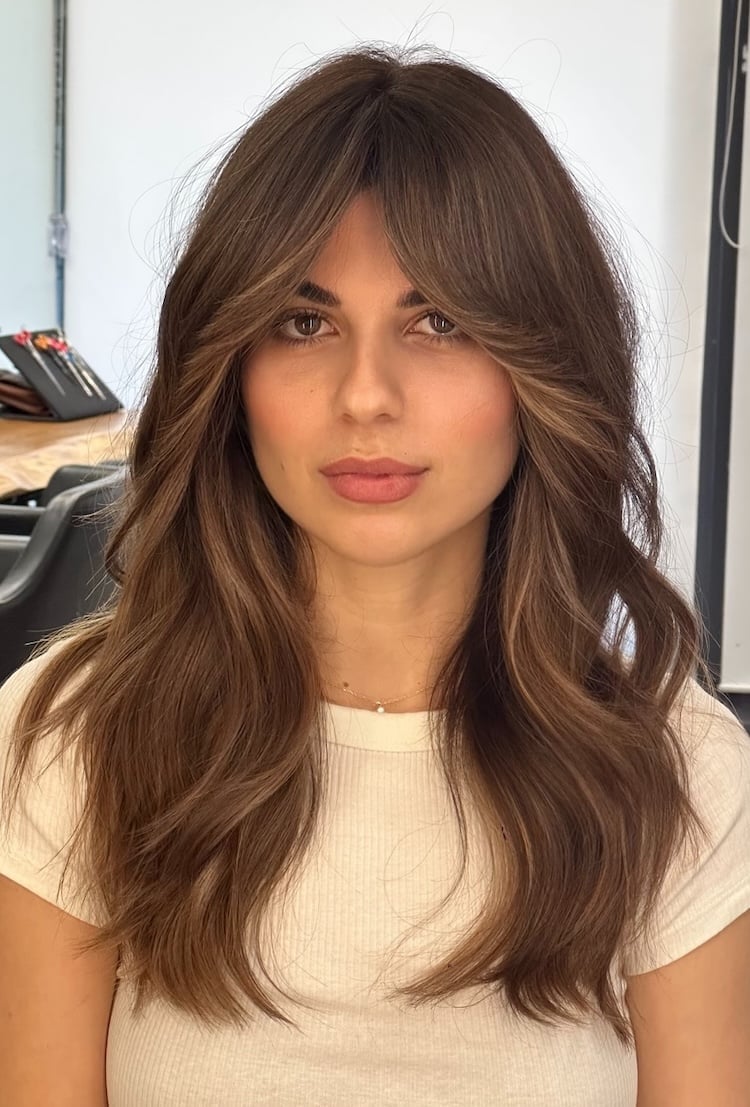 Rich Brown Base With Caramel Balayage And Curtain Bangs Rich Brown Base With Caramel Balayage And Curtain Bangs — Trendy Caramel Hair Color