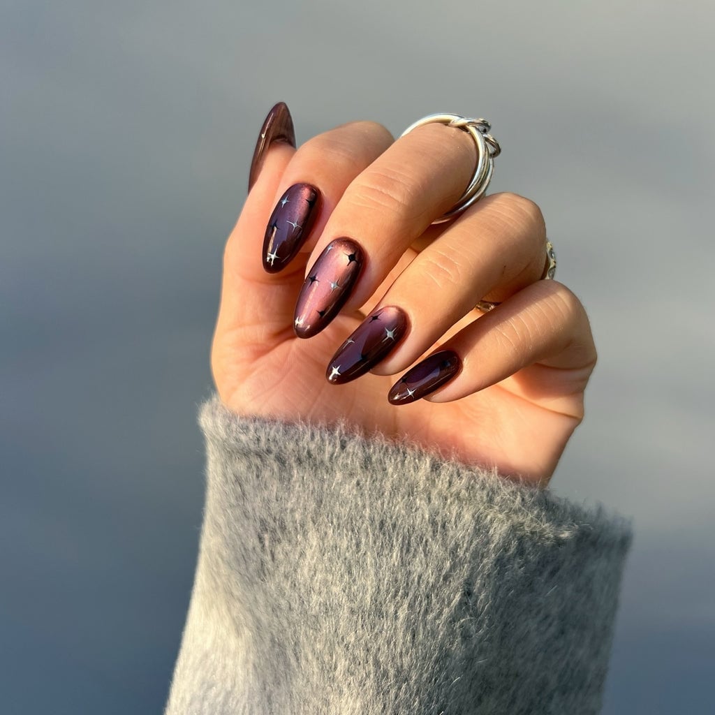 Deep Purple Cat Eye with Star Decals Short Almond Nails — Trendy Cat Eye Nail Art