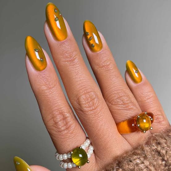 Mustard Yellow Cat Eye with Gold Dots Almond Nails — Trendy Cat Eye Nail Art