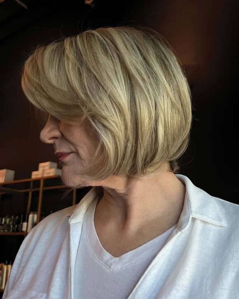 Blonde Bob With Side-Swept Bangs Blonde Bob With Side-Swept Bangs — Trendy Chin Length Hair