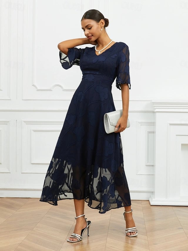 Navy Textured Fit and Flare Dress with Sheer Sleeves and Silver Clutch — Trendy Church Outfits