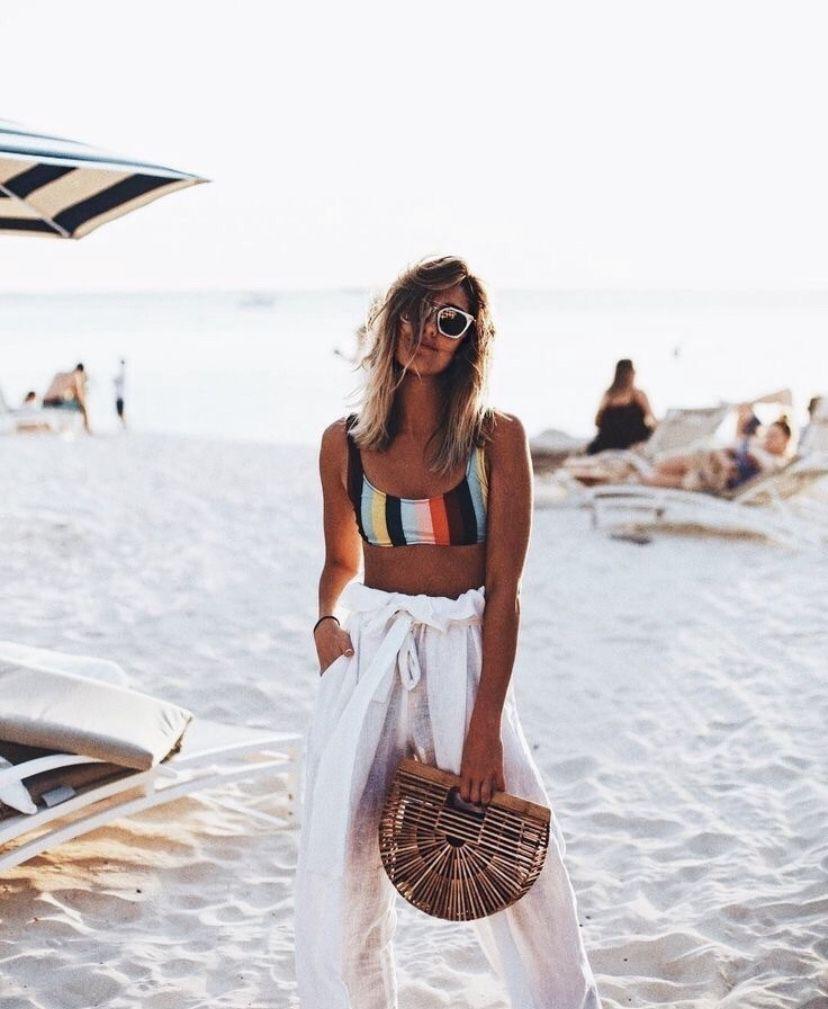 Striped Bikini Top and White Linen Pants on the Beach — Trendy Coastal Outfits