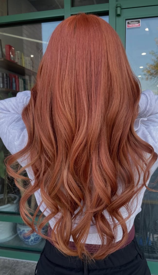 Paprika Balayage Mid-Back Length Waves With Sun-Kissed Strands — Trendy Copper Hair