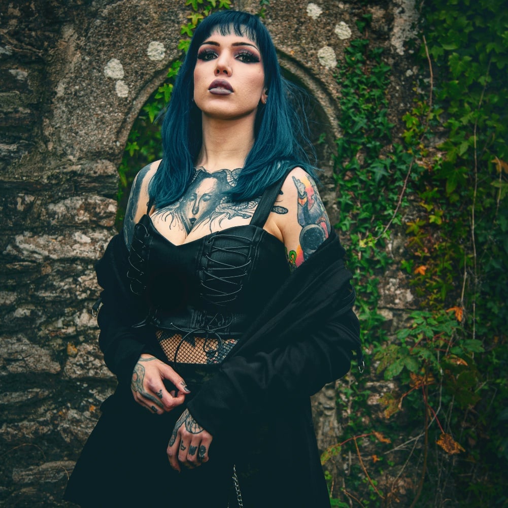 Black Corset Top with Gothic Lacing and Multiple Necklaces — Trendy Corset Top Outfits