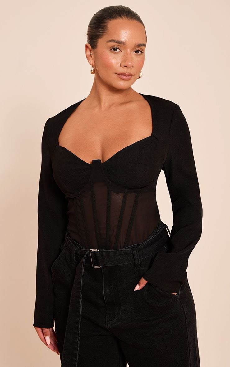 Black Top with Sheer Corset Panel and Gold Hoop Earrings — Trendy Corset Top Outfits