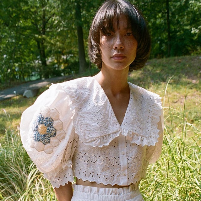 White Cropped Blouse with Ruffled Eyelet Collar — Trendy Cottagecore Outfits