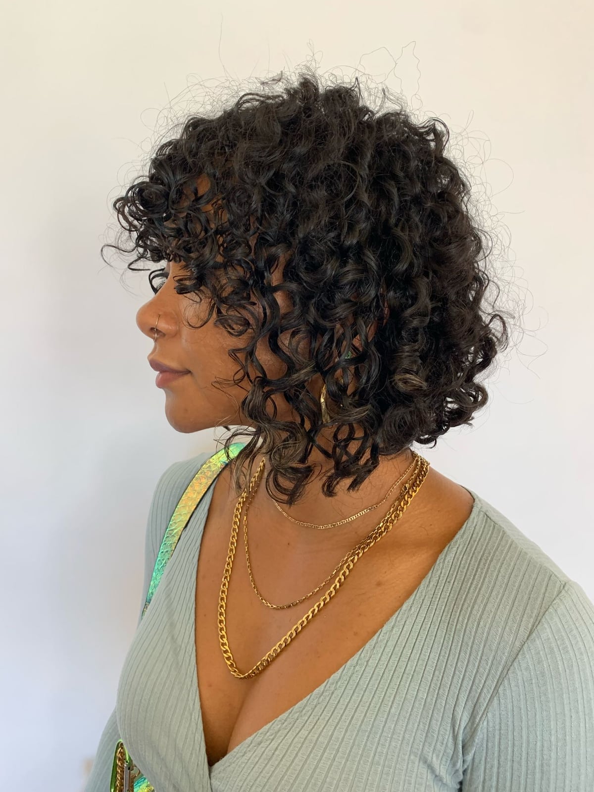 Chin Length Bob With Curly Fringe — Trendy Curly Hair