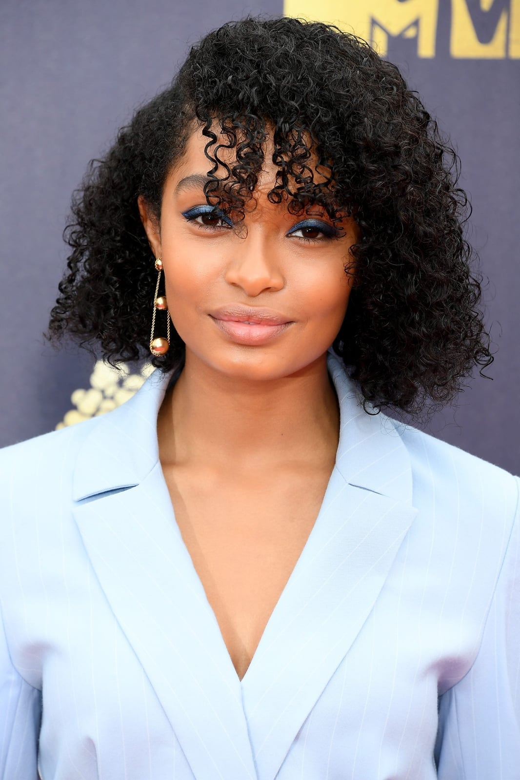 Collarbone Black Hair With Curly Bangs — Trendy Curly Hair
