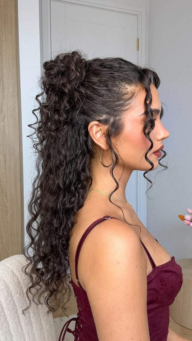 Mid-Back High Ponytail With Face-Framing Pieces — Trendy Curly Hair