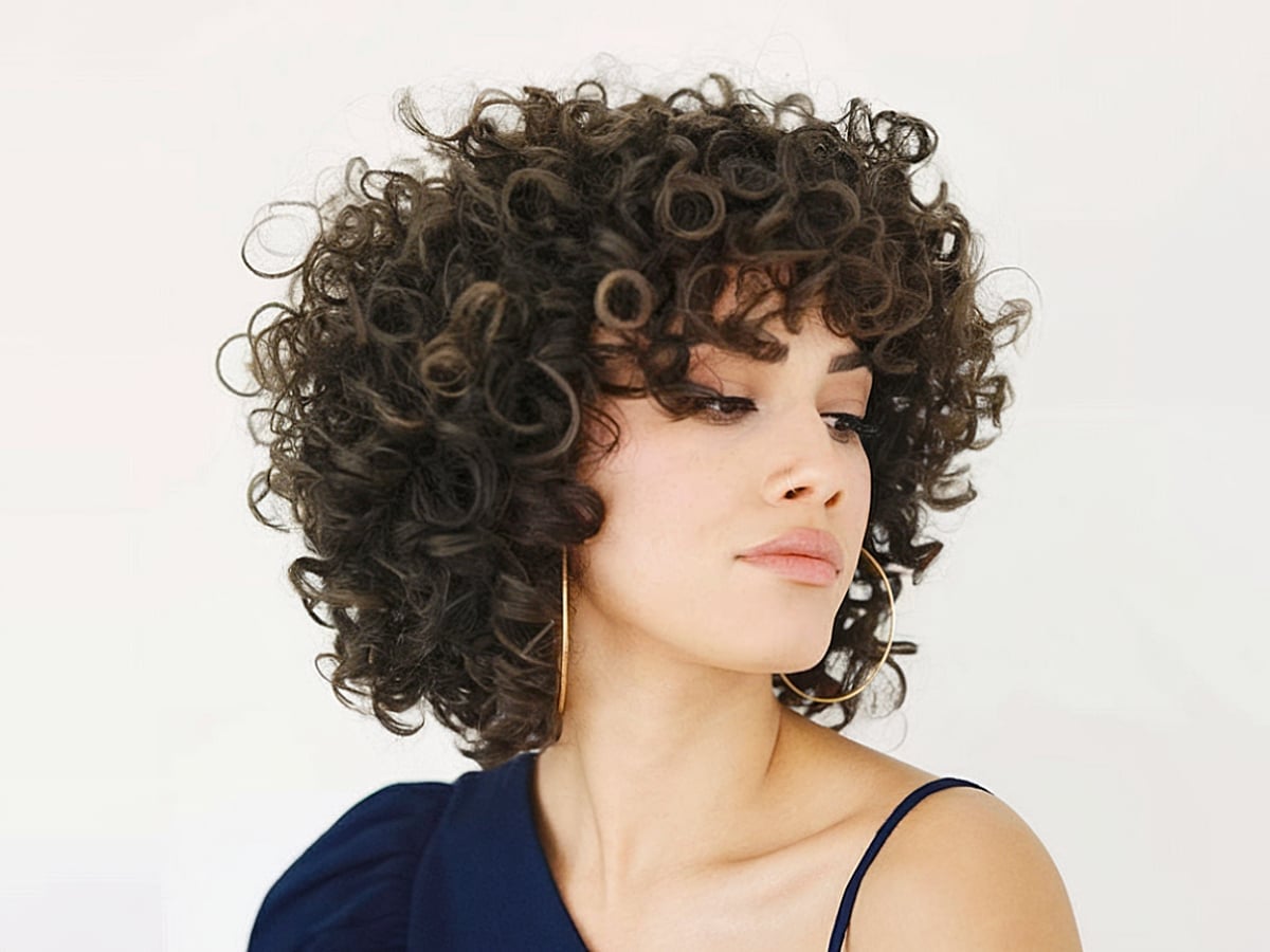 Chin Length Bob With Subtle Layers — Trendy Curly Hair