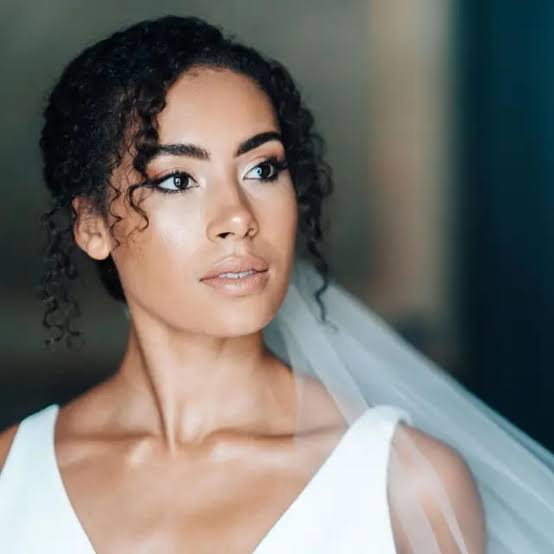 Dark Brown Updo With Softly Pulled-Back Curls Dark Brown Updo With Softly Pulled-Back Curls — Trendy Curly Hair Wedding