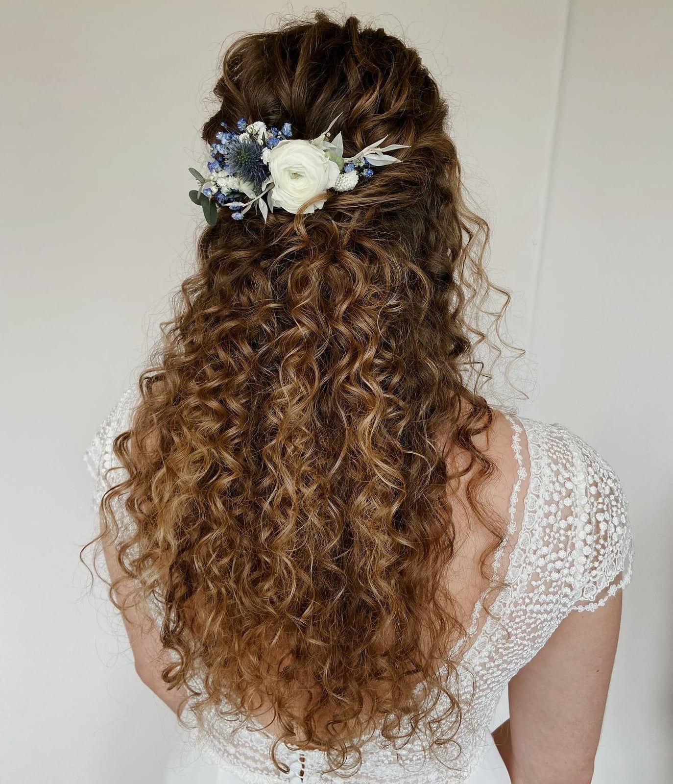 Intricate Dark Brown Curly Updo With Blonde Highlights Intricate Dark Brown Curly Updo With Blonde Highlights — Trendy Curly Hair Wedding