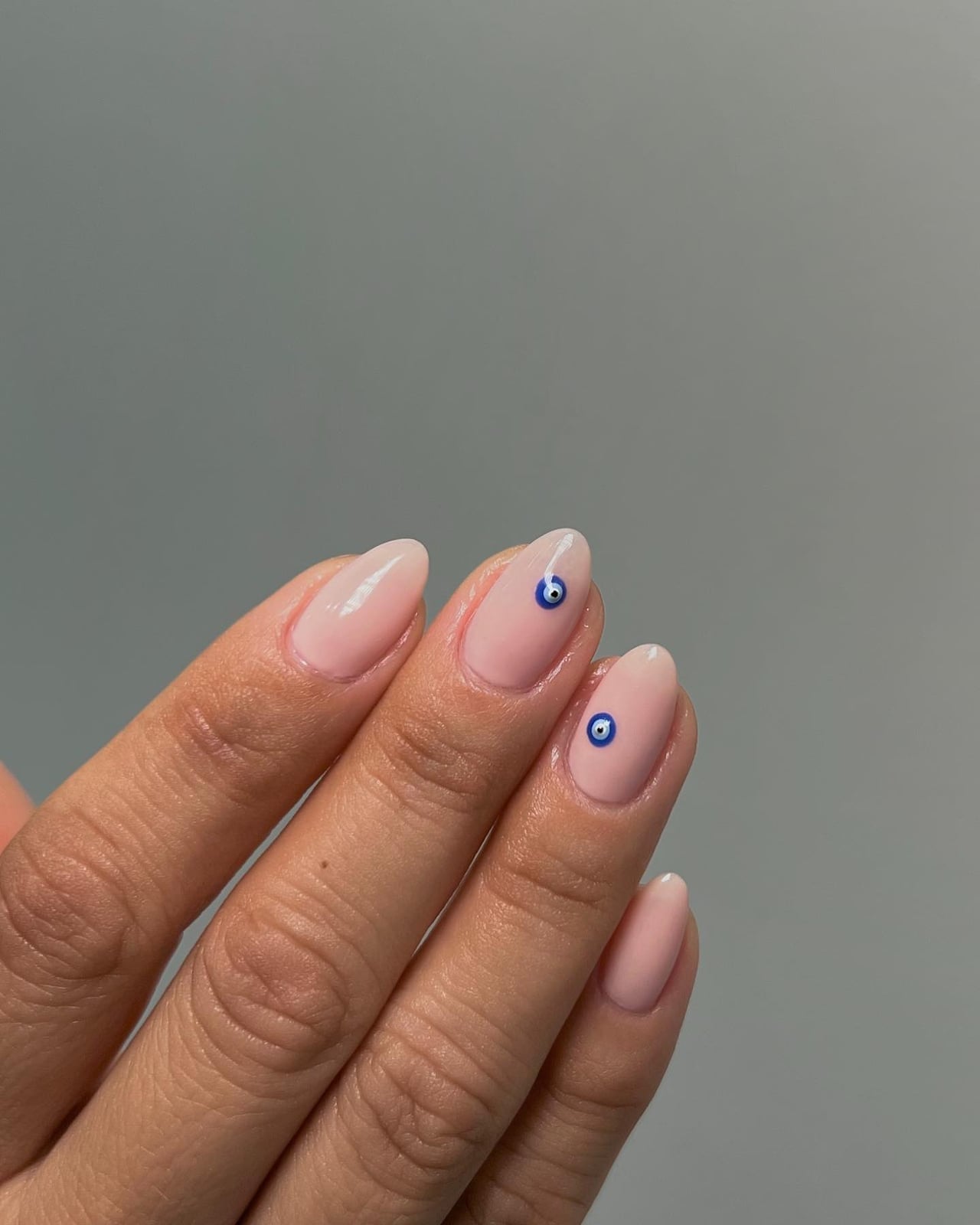 Milky Pink Nude Evil Eye Medium Almond Nails Milky Pink Nude Evil Eye Medium Almond Nails — Trendy Evil Eye Nails