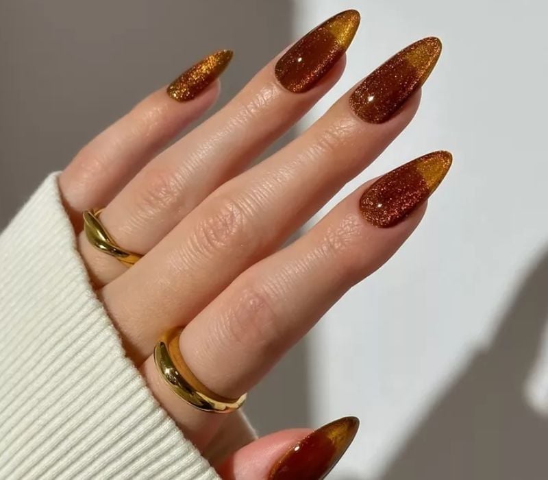 Medium Almond Deep Brown Cat-Eye With Gold Glitter Tips — Trendy Gold Nails