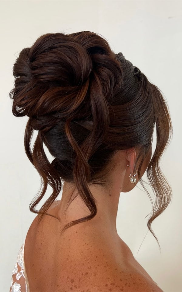 Low Messy Bun With Auburn Highlights — Trendy Hair Up Hairstyles