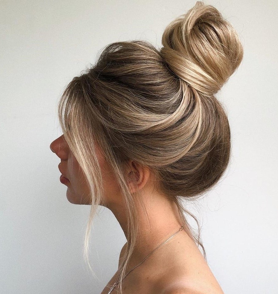 Voluminous Messy Bun With Curtain Bangs — Trendy Hair Up Hairstyles