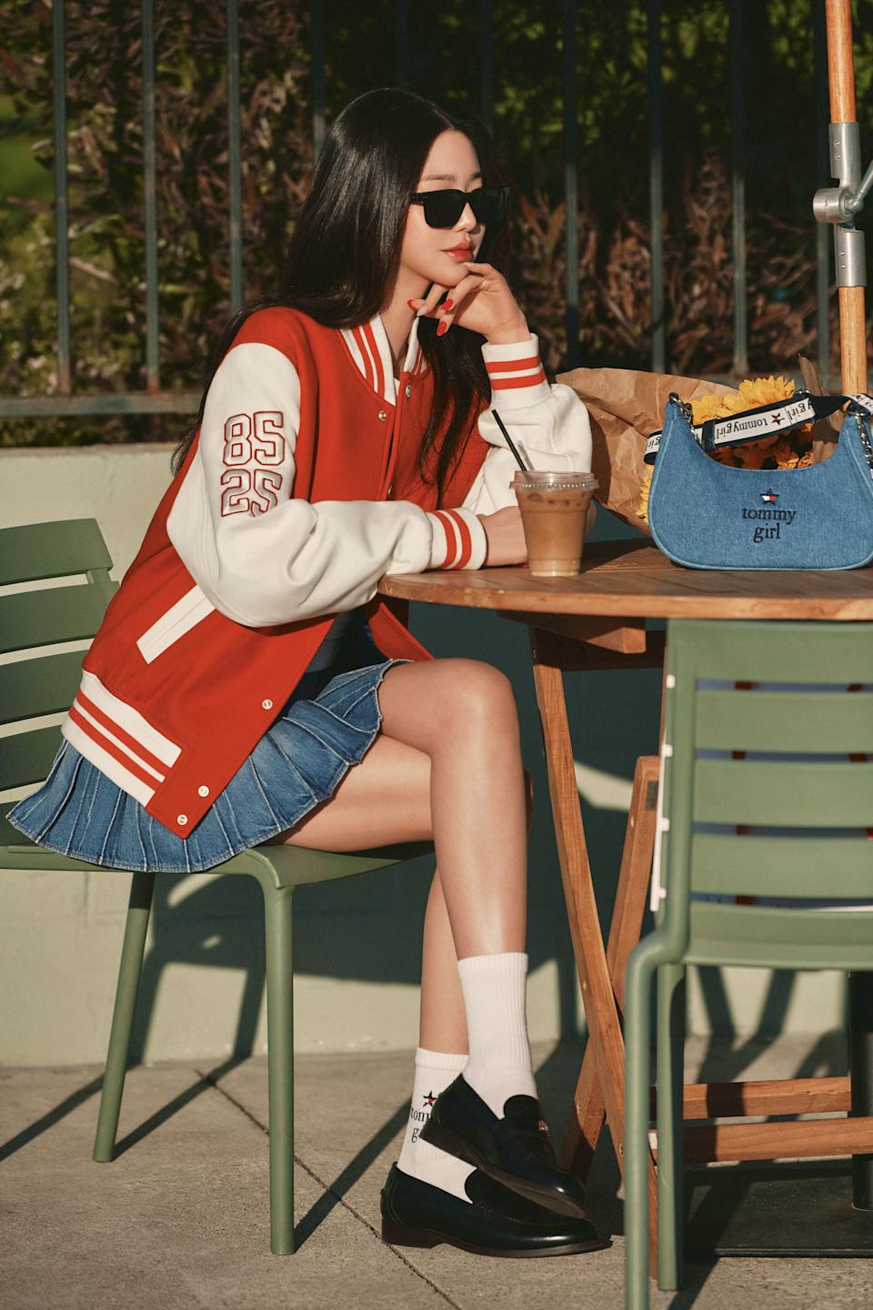 Varsity Jacket Over Denim Pleated Skirt With Black And White Loafers Varsity Jacket Over Denim Pleated Skirt With Black And White Loafers — Trendy K-pop Outfits