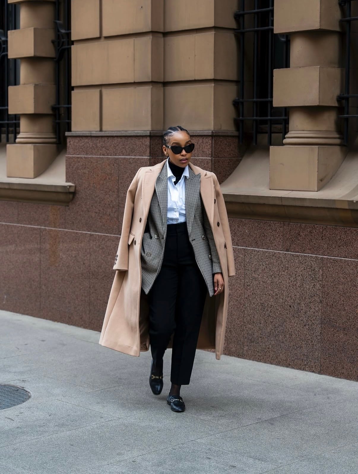 Camel Coat Draped Over Houndstooth Blazer and Trousers Camel Coat Draped Over Houndstooth Blazer and Trousers — Trendy Layering Outfits